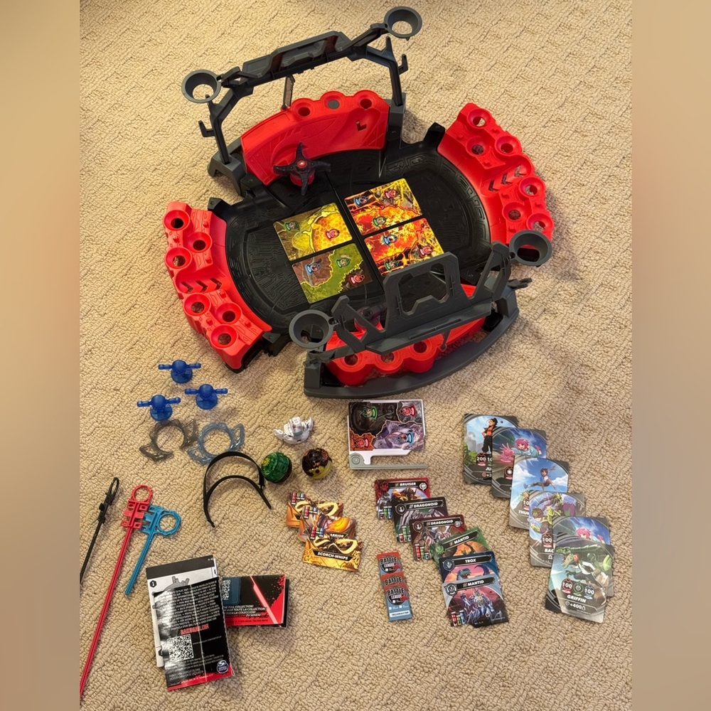 Bakugan arena and additional battle cards/pieces.
